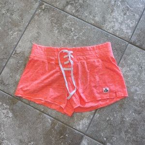 Victoria’s Secret PINK neon orange shorts. NWOT xs